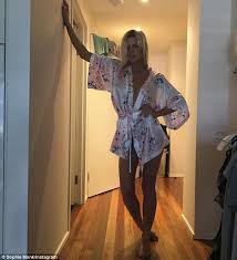 Sophie Monk flaunts her toned legs and cleavage in silk robe ...